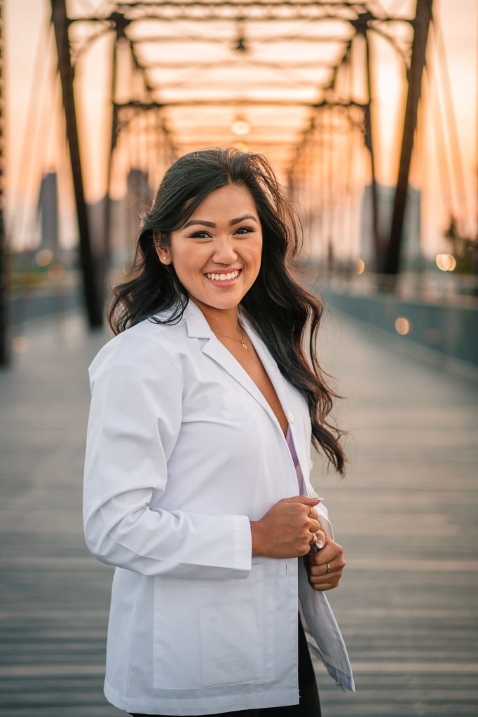 stephanie tran in dentist coat