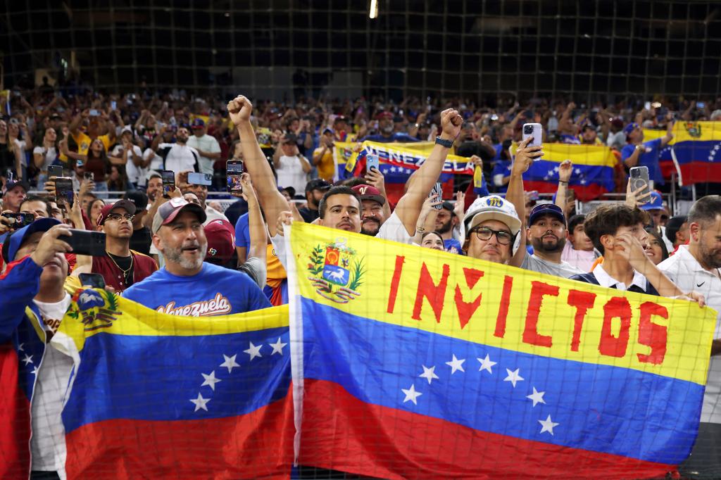 Venezuela baseball fans cheer on their team during the 2023 World Baseball Classic in Miami.