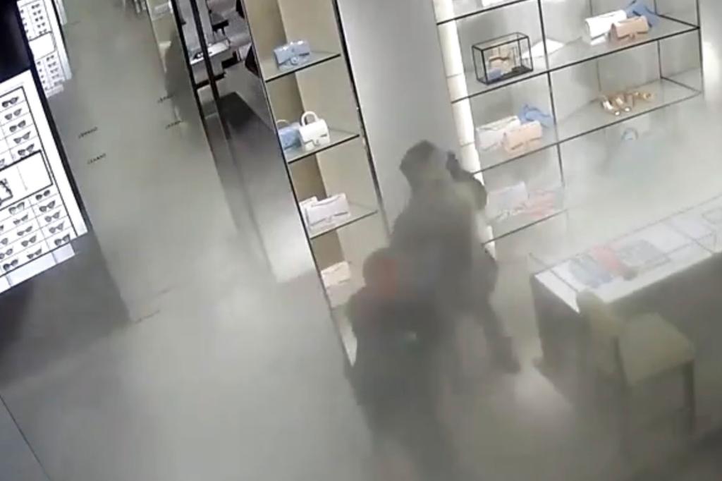 One of the robbers deployed the wildly spraying fire extinguisher to distract the employees, who were just 30 minutes short of shutting down the luxury store for the day.