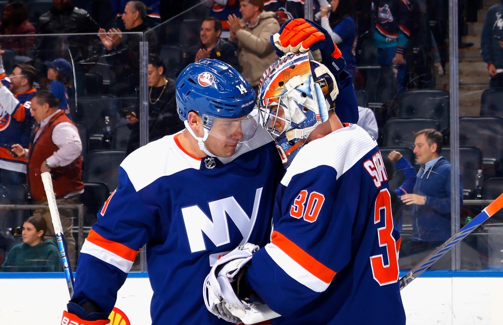 Bo Horvat and Ilya Sorokin of the New York Islanders celebrate a 3-1 victory over the Edmonton Oilers at UBS Arena on Dec. 19, 2023.