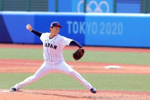 Japan's starting pitcher Yoshinobu Yamamoto hurls the ball during the fourth inning of the Tokyo 2020 Olympic Games.