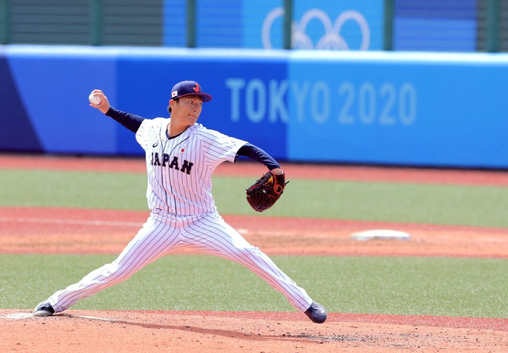 Japan's starting pitcher Yoshinobu Yamamoto hurls the ball during the fourth inning of the Tokyo 2020 Olympic Games.