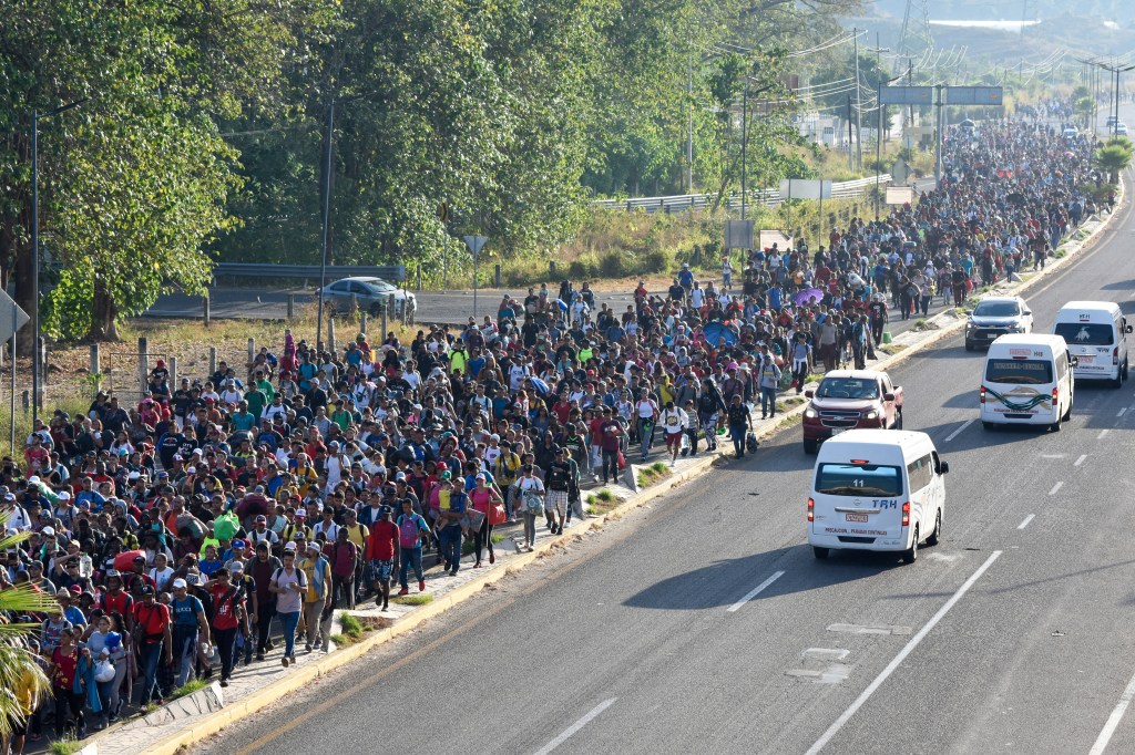 Migrants depart from Tapachula, Mexico, Sunday, Dec. 24.