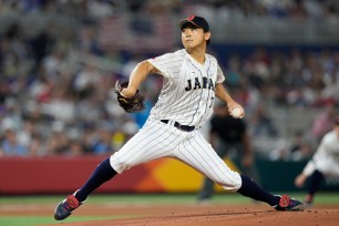 Japan pitcher Shota Imanaga throws during the first inning of the World Baseball Classic championship game against the United States.