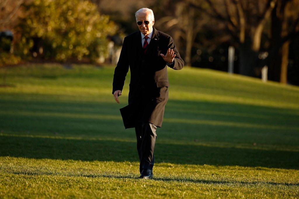 President Joe Biden walks across the South Lawn after returning to the White House on December 11, 2023 in Washington, DC.