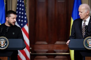 Volodymyr Zelensky and Joe Biden stand at podiums