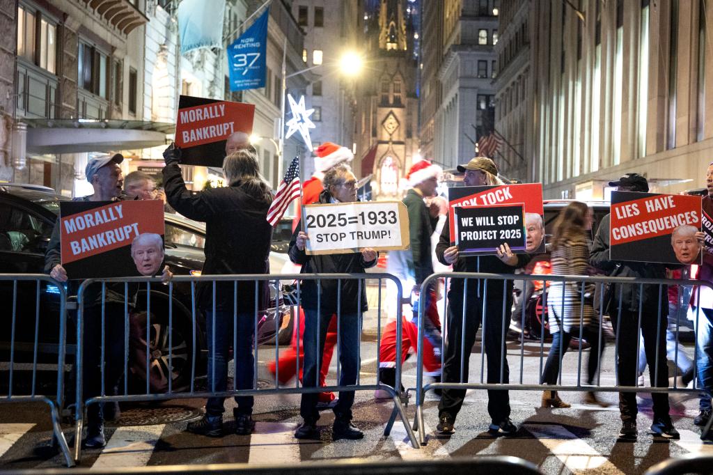 People protest outside Cipriani Wall Street prior to the start of the gala. 