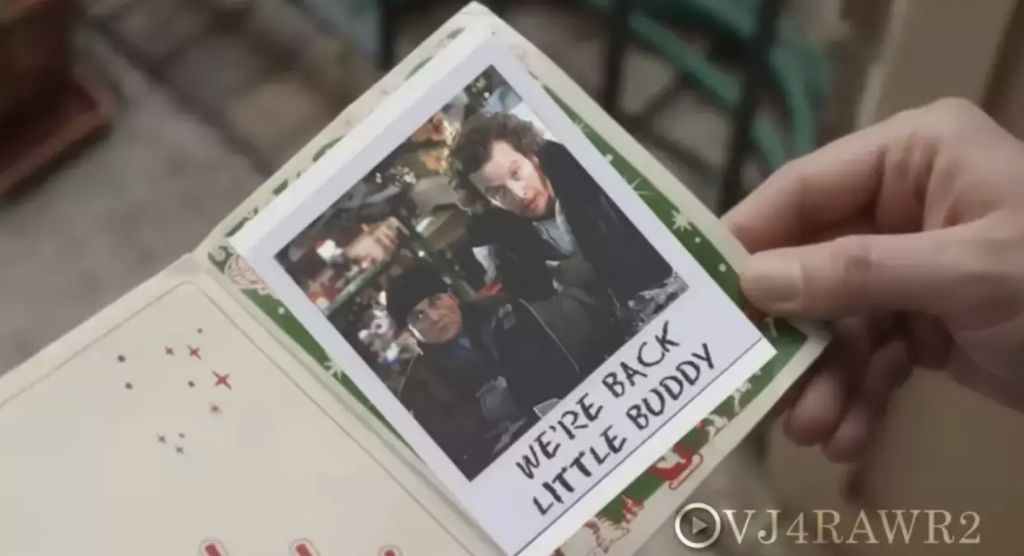 Bending down, Culkin opens the card to reveal a photo of his arch-nemeses Harry (Joe Pesci) and Marv (Daniel Stern) with the words "We're back little buddy." 