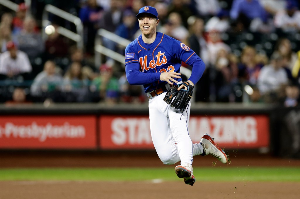 Brett Baty #22 of the New York Mets throws out Cristian Pache (not in the picture) #19 of the Philadelphia Phillies 