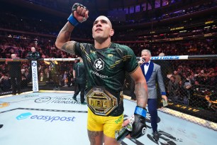 Alex Pereira celebrates winning the UFC light heavyweight championship on Nov. 11, 2023, at Madison Square Garden.