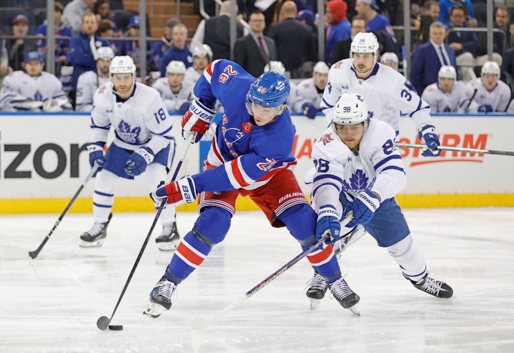 Rangers wing Jimmy Vesey with the puck against the Maple Leafs on Dec. 12, 2023.