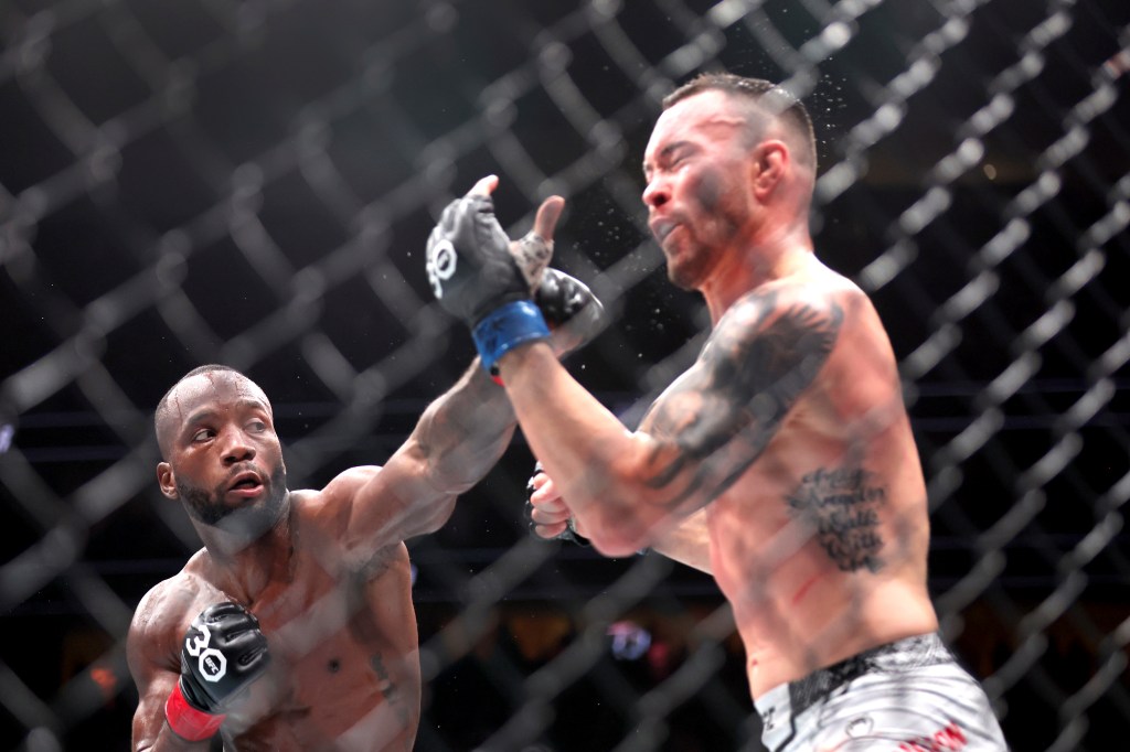 Leon Edwards lands a punch on Colby Covington at UFC 296.