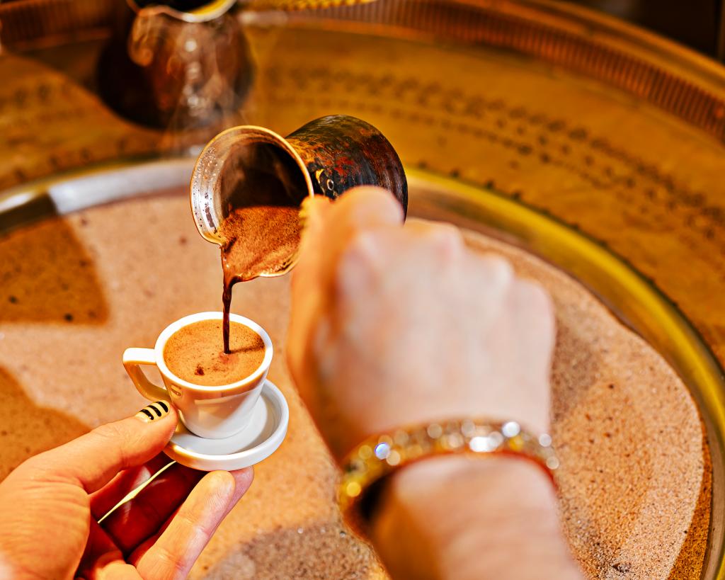 The coffee is made on a bed of scorching hot sand.