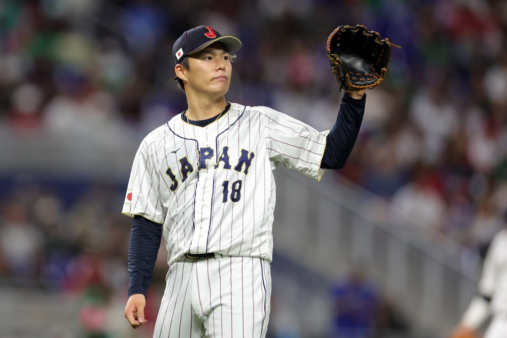  Yoshinobu Yamamoto #18 of Team Japan reacts in the fifth inning against Team Mexico