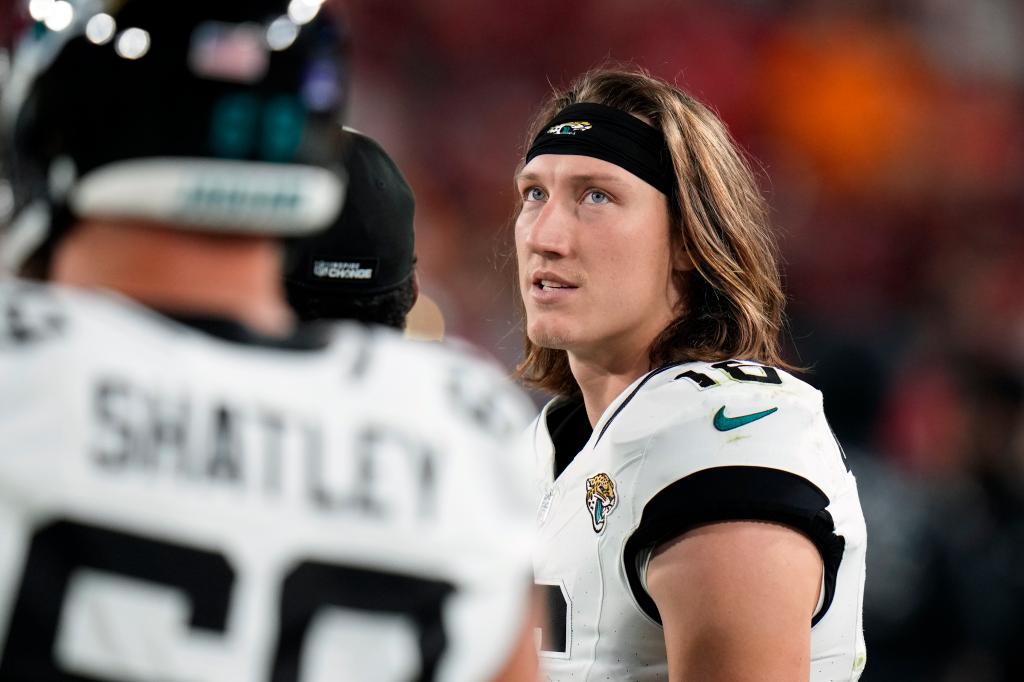 Jacksonville Jaguars quarterback Trevor Lawrence (16) paces in the bench area after he was injured during the second half of an NFL football game against the Tampa Bay Buccaneers Sunday, Dec. 24, 2023