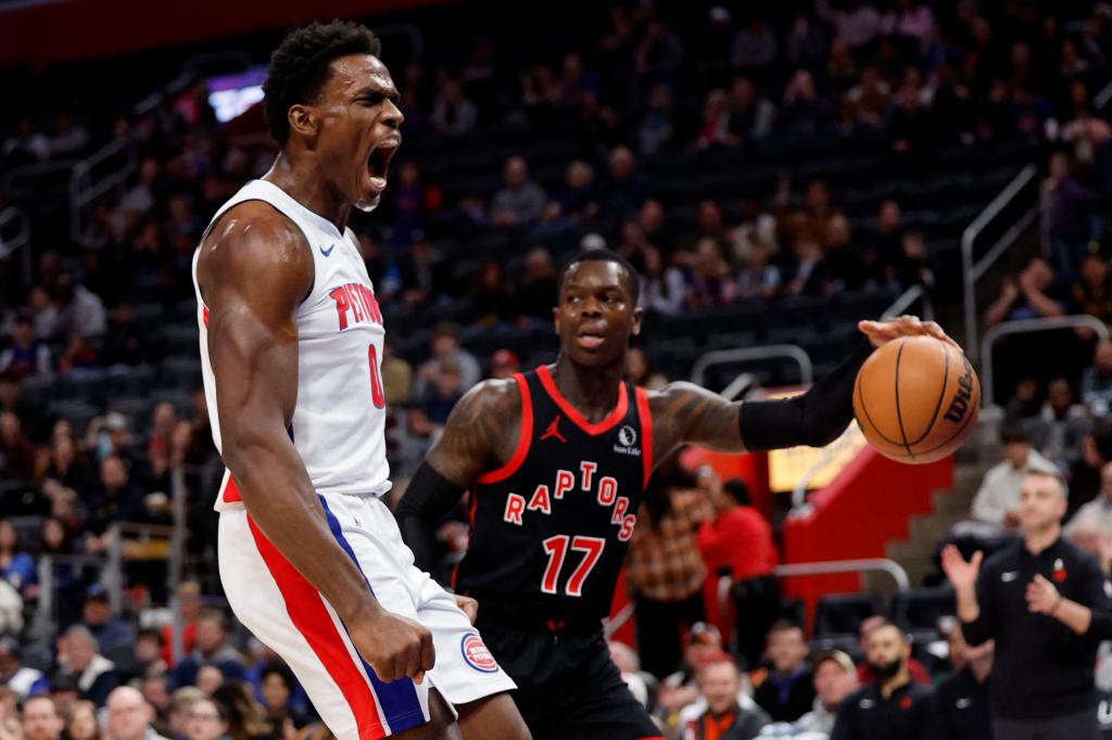 Jalen Duren celebrates after slamming home a dunk during the Pistons' 129-127 victory over the Raptors, snapping their NBA record-tying losing streak at 28 games.