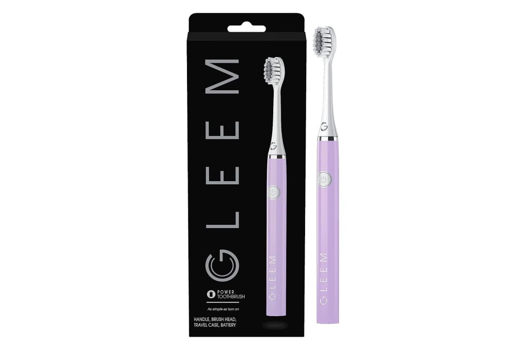 A lavender toothbrush and its packaging.