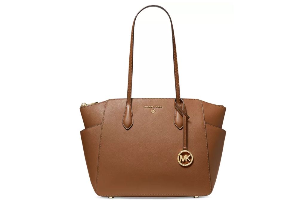 A brown tote with a Michael Michael Kors logo on the hardware.