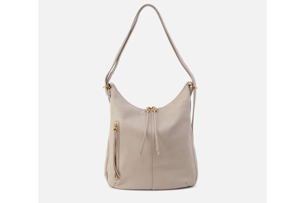 A convertible purse in the color cream.