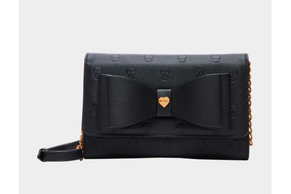 A black purse with gold hardware.