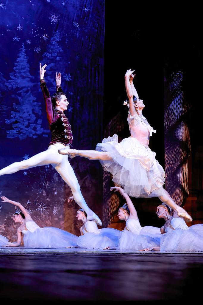Nutcracker and ballerina dancing on stage