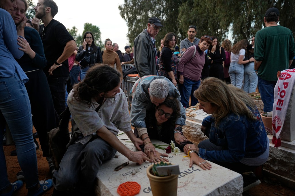 Mourners in cemetery