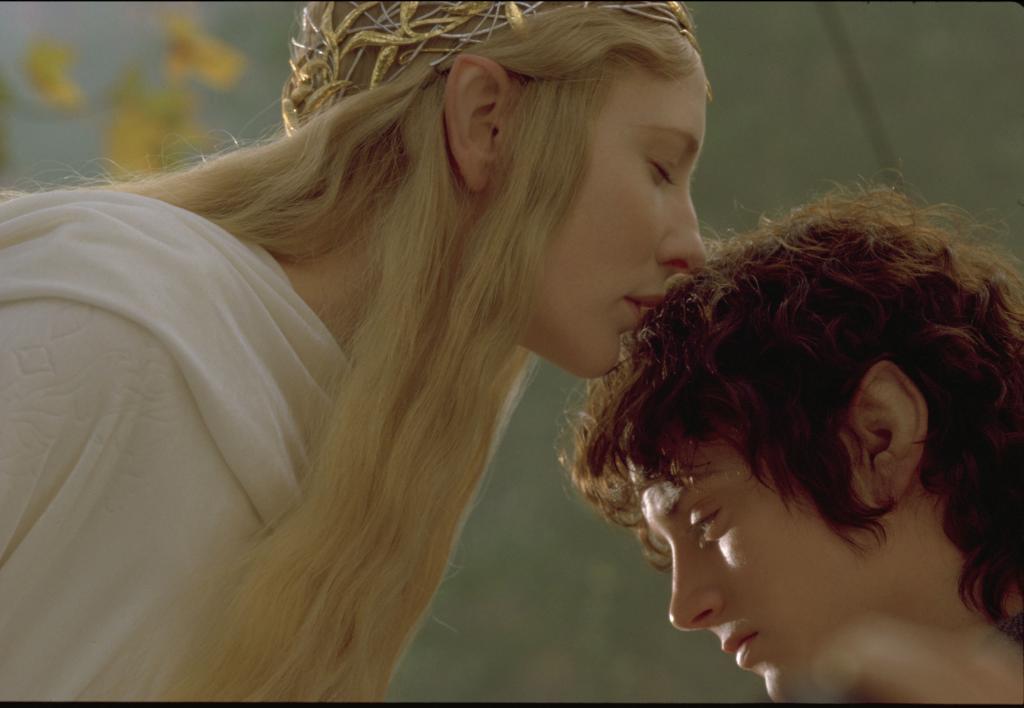 Cate Blanchett kissing Elijah Wood on the head. 