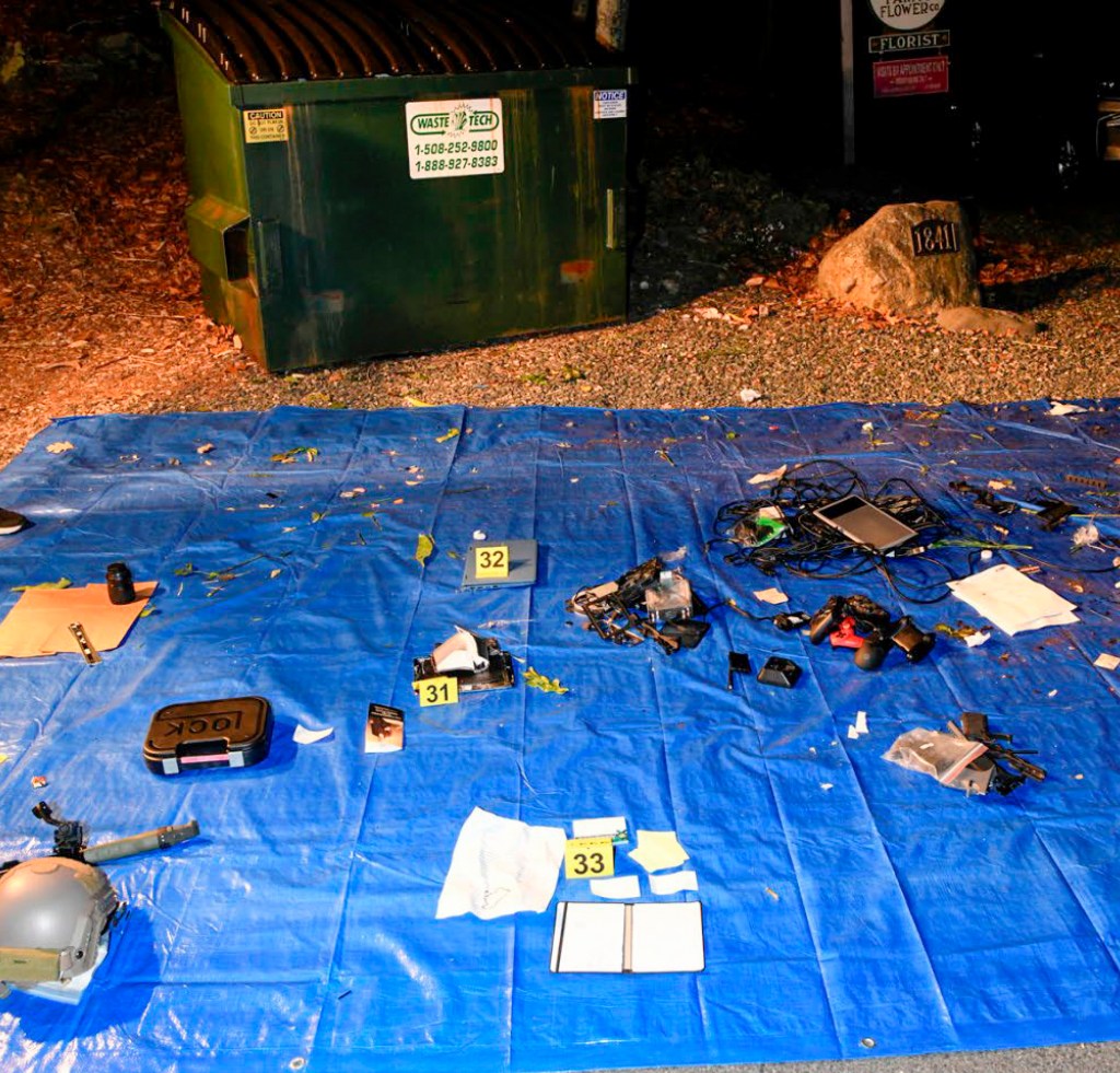 This image contained in Justice Department motion for continued pretrial detention of Jack Teixeira, shows electronic items recovered from a dumpster at his mother and stepfather's home in North Dighton, Mass. 