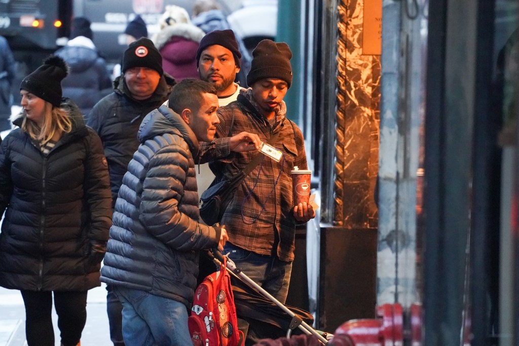 Migrants showing ID to enter hotel