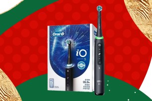 Oral B toothbrush on a holiday-themed background.