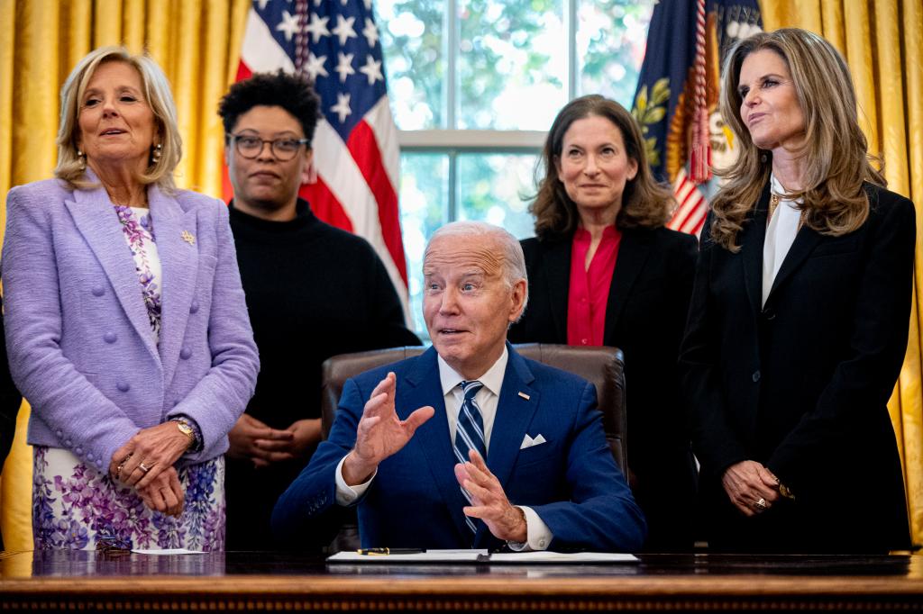 President Joe Biden, accompanied by from left, first lady Jill Biden, Office of Management and Budget director Shalanda Young, White House Gender Policy Council director Jen Klein, and Women's Alzheimer's Movement founder Maria Shriver, speaks before signing a presidential memorandum that will establish the first-ever White House Initiative on Women's Health Research in the Oval Office of the White House, Monday, Nov. 13, 2023, in Washington.