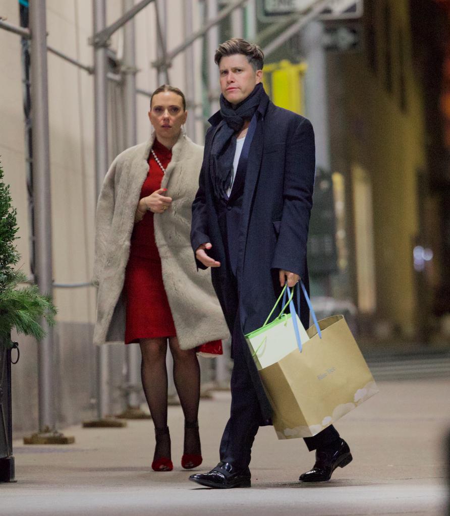 Scarlett Johansson and Colin Jost looking serious. 
