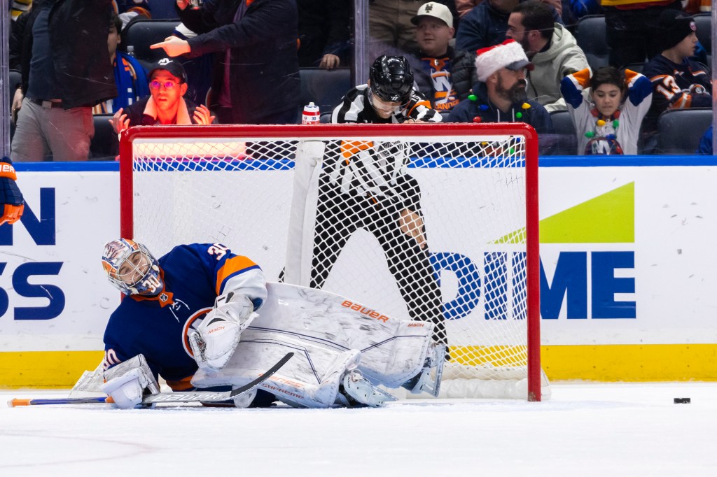 Bruins defenseman Mason Lohrei (6) scores on Islanders goaltender Ilya Sorokin (30) during the third period at UBS Arena.