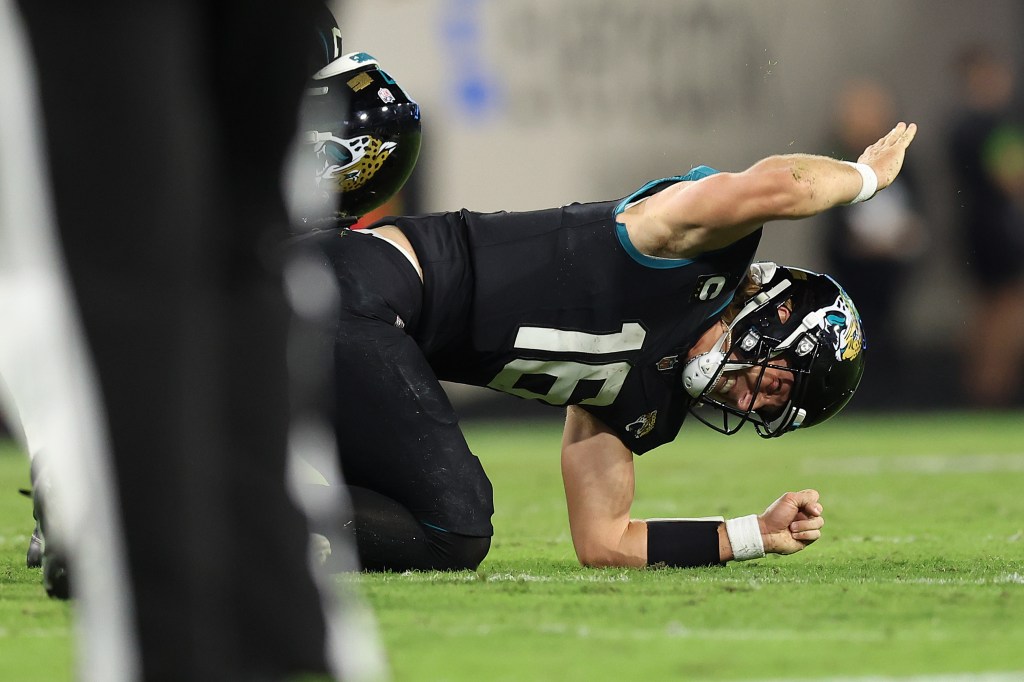 Trevor Lawrence reacts after suffering an ankle injury during the Jaguars' loss to the Bengals on Dec. 4, 2023.