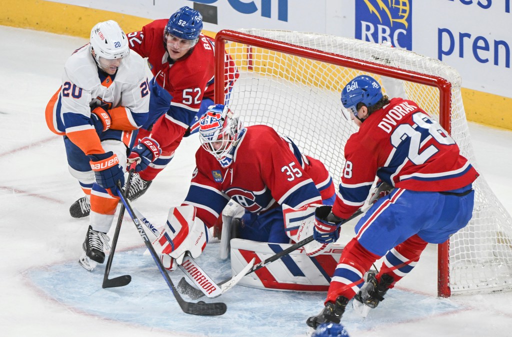 Hudson Fasching (20) tries to put the puck past Montreal Canadiens goaltender Sam Montembeault.