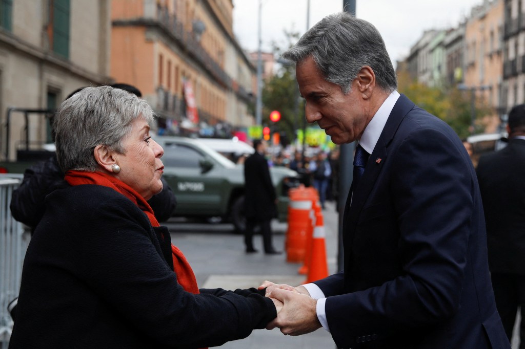 Blinken speaking with Mexico's Foreign Minister Alicia Barcena.