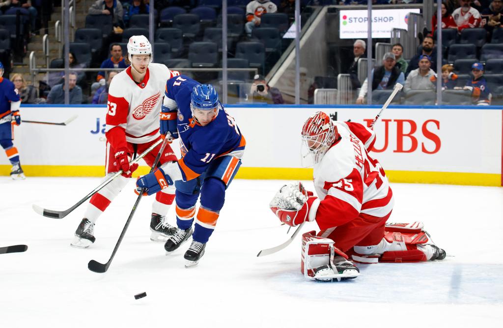 Goalie stops a backhand attempt by Zach Parise during a Detroit Red Wings vs New York Islanders NHL hockey game in Elmont, NY.