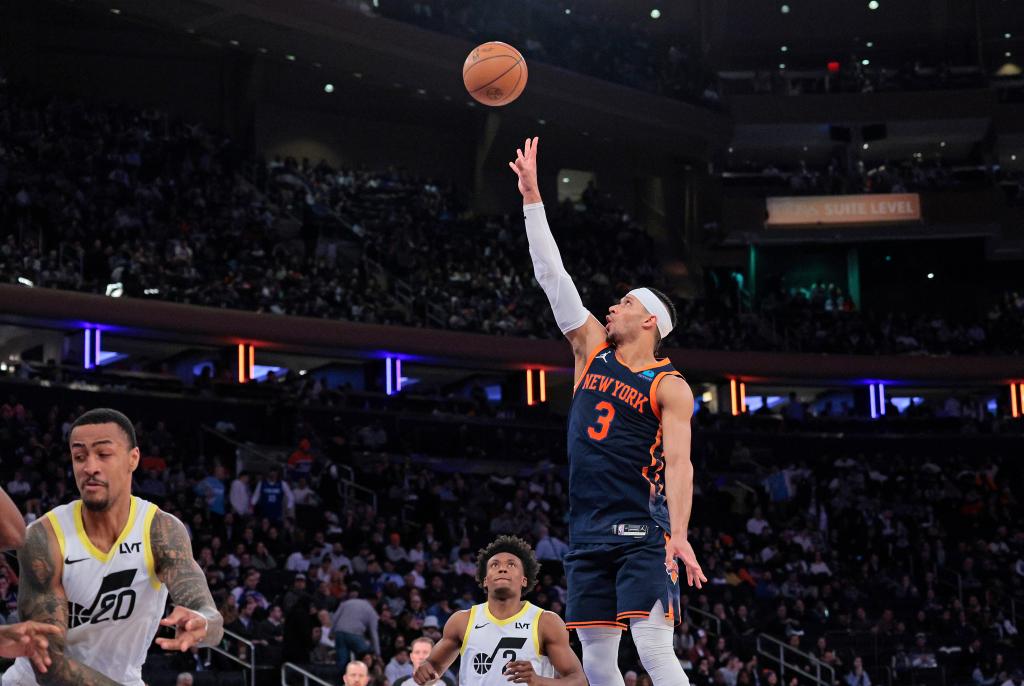 New York Knicks guard Josh Hart #3 puts up a shot over Utah Jazz guard Collin Sexton #2 during the third quarter.