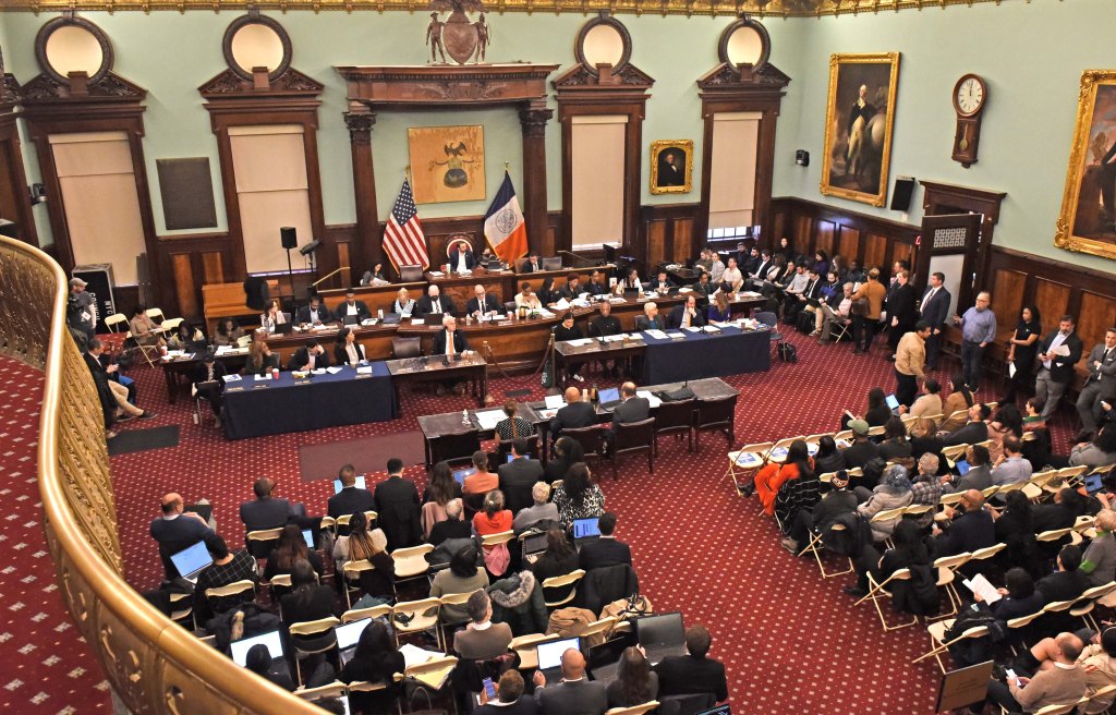 A group of people, including Jacques Jiha, Ph.D., Director of the Mayor's Office of Management and Budget, sitting in a room at City Hall, NY.