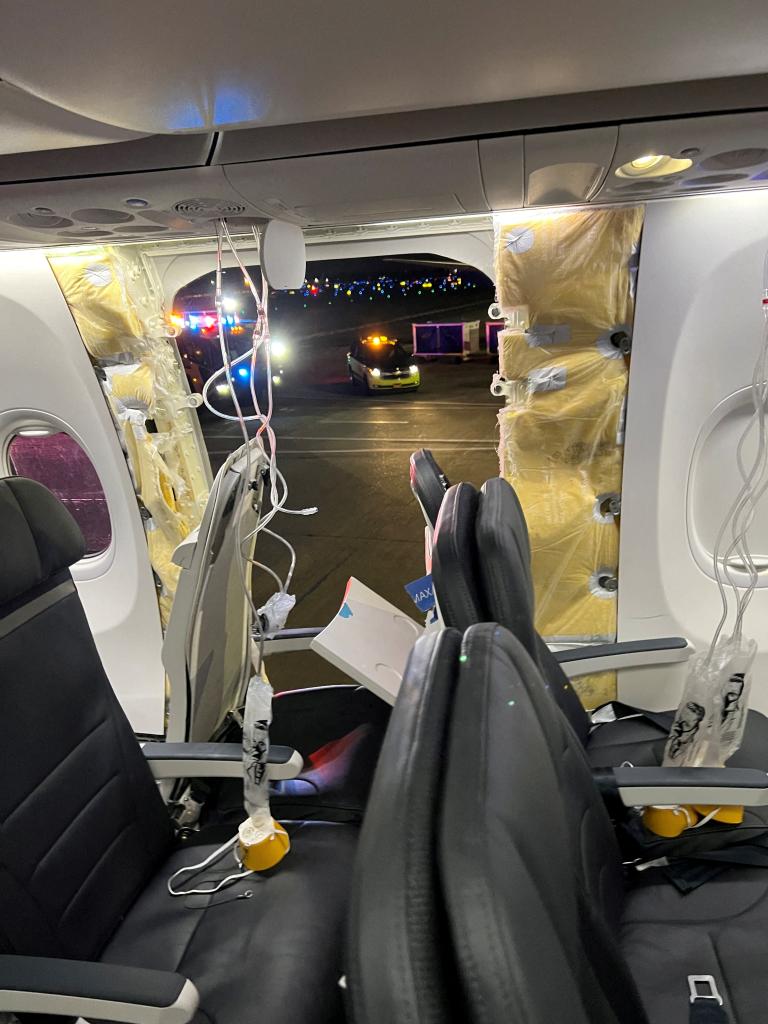 Blown open door seen from inside the plane after landing