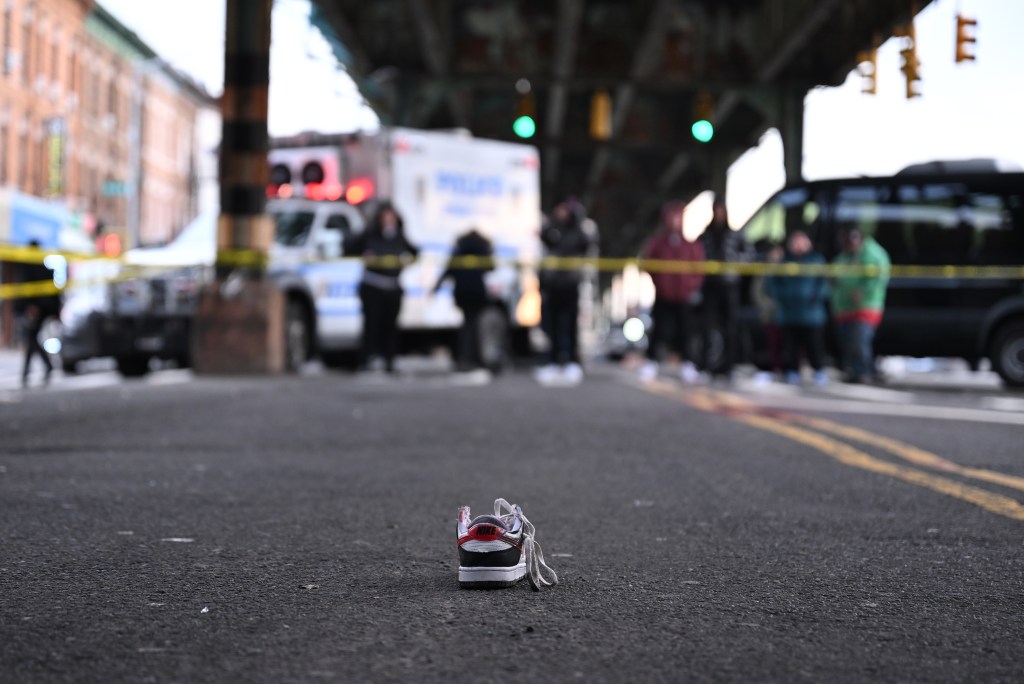 One of the shoes worn by the 14-year-old subway surfing victim fell to the street beneath the elevated tracks.