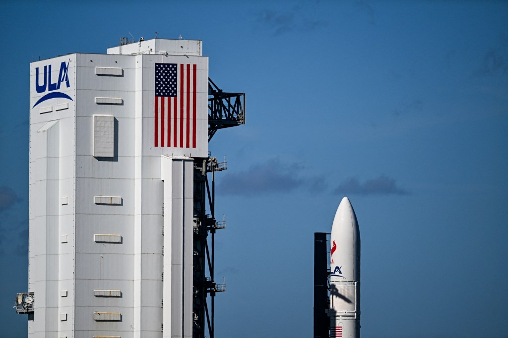 Vulcan Centaur rocket next to a ULA building 