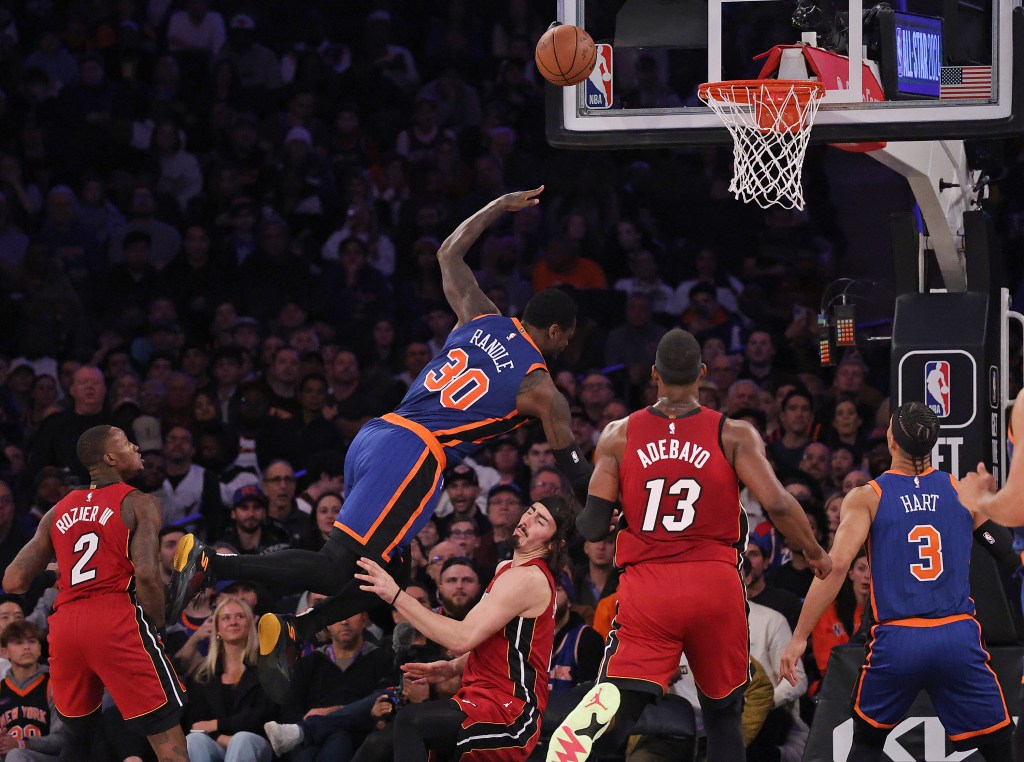 New York Knicks forward Julius Randle (30) goes up for a shot and falls over 