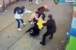 A group of people on a sidewalk beating up cops.