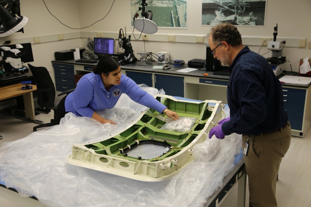 Leani Benitez-Cardona, NTSB aerospace engineer, and Matthew Fox, NTSB chief technical advisor for materials, unpacking the door plug Sunday (14 Jan) from Alaska Airlines flight 1282, a Boeing 737-9 MAX, in the materials laboratory at NTSB headquarters in Washington, D.C. See SWNS story SWSMplug. The door plug from the Boeing 737-9 MAX jet incident has arrived at NTSB (National Transportation Safety Board) Materials Laboratory. On Sunday (14 Jan), the team began examining the panel Alaska Airlines airplane that detached from the fuselage on 5 January. The Boeing 737 Max 9 had been forced to return to Portland, Oregon minutes after takeoff. The missing section of plane was found in the back garden of a Portland teacher.
