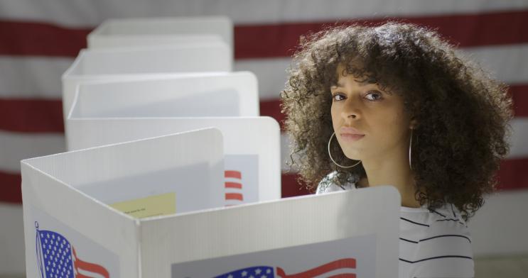 Young woman casting a ballot