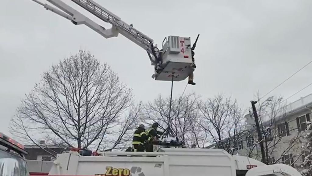 The fire department pulling her from the garbage truck. 