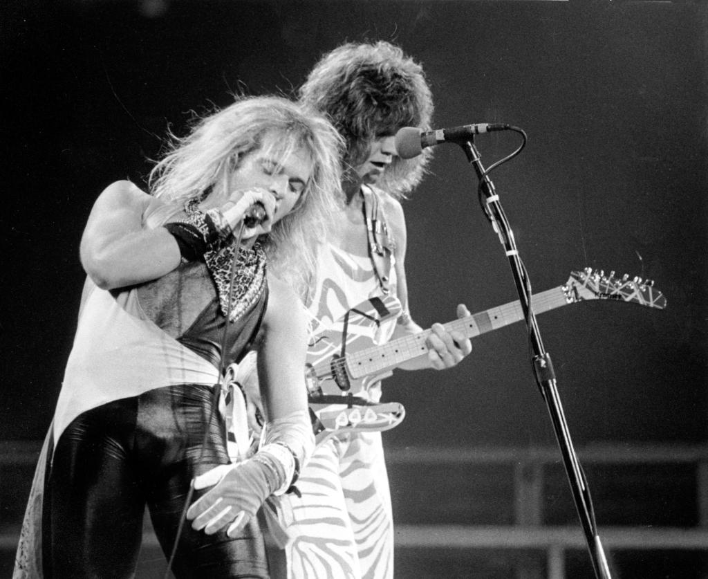 Roth, left, and lead guitarist Eddie Van Halen of the rock group Van Halen perform during their concert at the Spectrum in Philadelphia, Pa., on Oct. 19, 1982.  