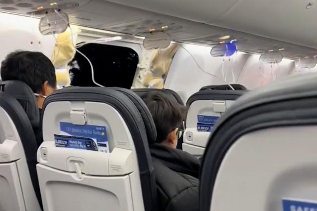 Passengers seen while the door is blown open mid flight