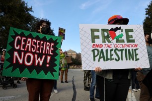 People gather and hold up a 'Ceasefire and free Palestine' sign at a 'Protect Palestine Rally' at the Texas State Capitol in Austin Texas, USA, 06 January 2024